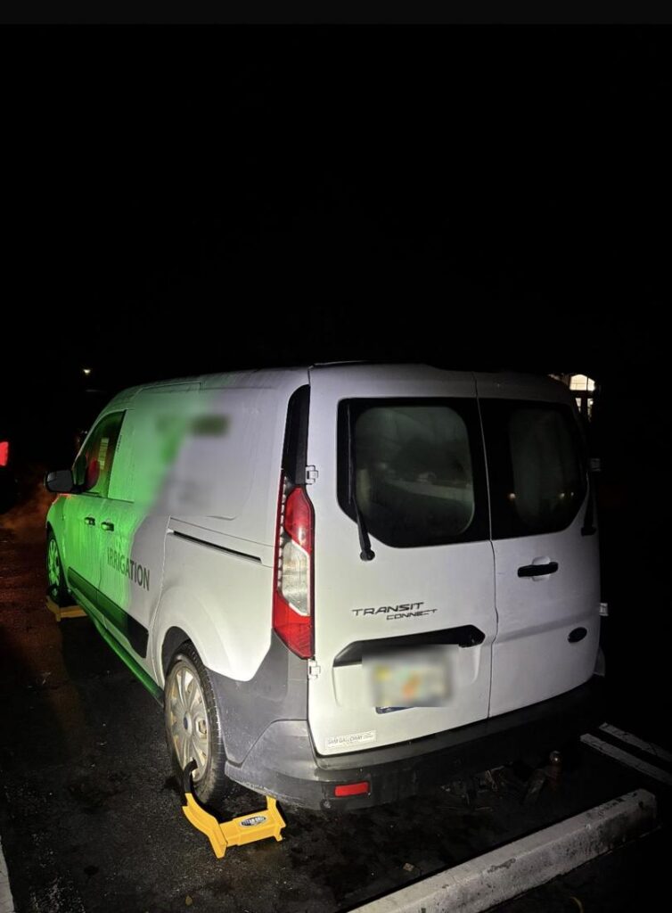 Booted commercial van at night