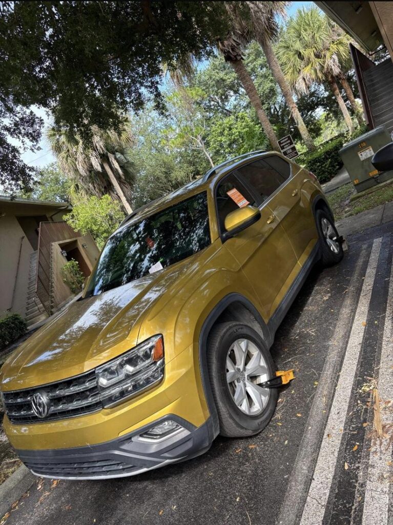 Booted Volkswagen SUV in a permit-only area